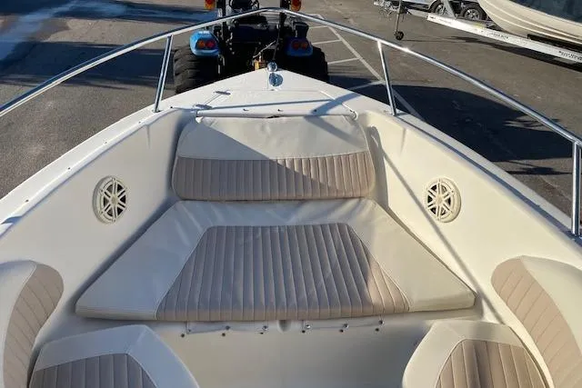 Slide: The Image of 2005 Scout 205 Dorado boat with beige seating and stainless steel railings. - 5