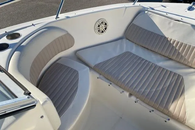 Slide: The Image of 2005 Scout 205 Dorado boat interior with cushioned seating and cup holders. - 7