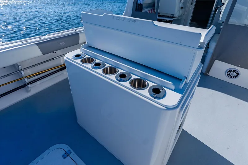 Slide: The Image of 2024 Steiger Craft 31 Fisherman boat deck with rod holders and storage. - 11