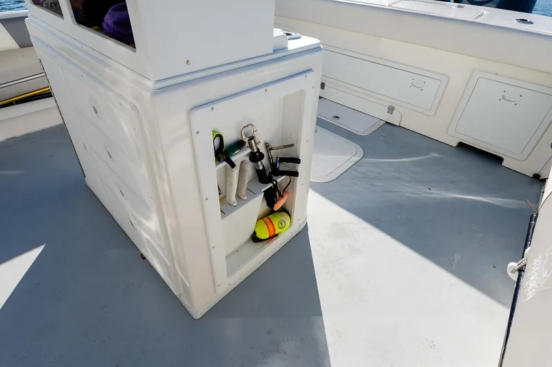 Slide: The Image of 2024 Steiger Craft 31 Fisherman boat deck with storage and fishing gear. - 15