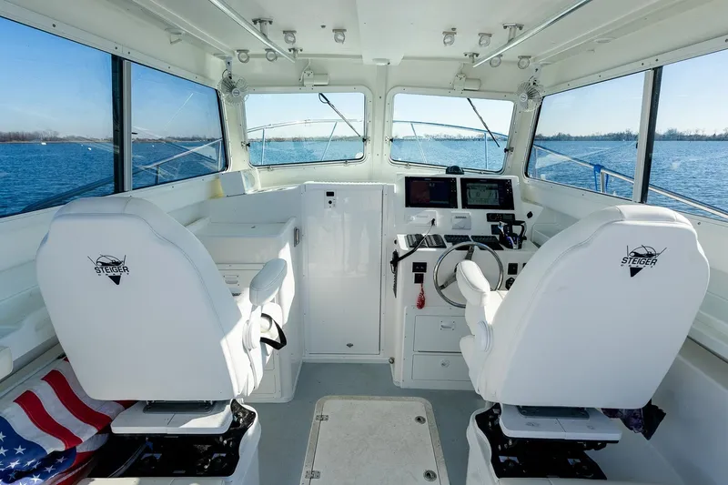 Slide: The Image of 2024 Steiger Craft 31 Fisherman boat interior with steering console and seating. - 27