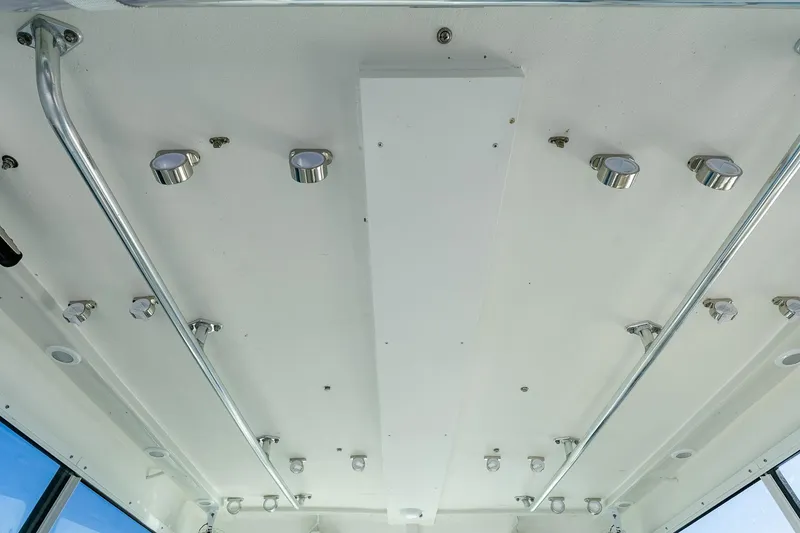 Slide: The Image of Ceiling view of 2024 Steiger Craft 31 Fisherman boat with mounted lights and metal rails. - 31
