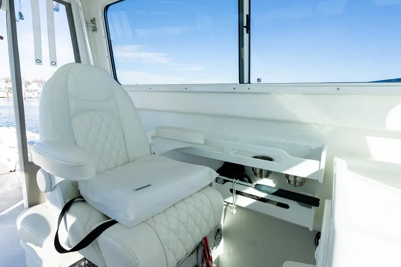 Slide: The Image of Luxurious interior of 2024 Steiger Craft 31 Fisherman with white seating and ocean view. - 36