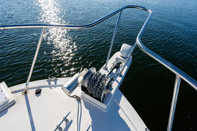Slide: The Image of Bow of 2024 Steiger Craft 31 Fisherman with anchor chain, glistening water. - 39