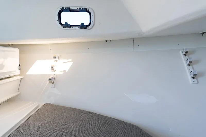 Slide: The Image of 2024 Steiger Craft 31 Fisherman cabin interior with window and storage. - 47