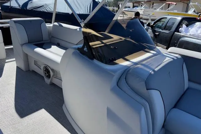 Slide: The Image of 2026 Tahoe Pontoon SP 2385 EL interior with plush seating and modern design. - 11