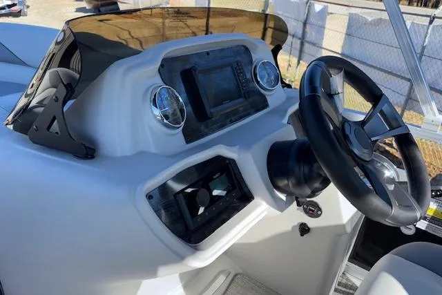 Slide: The Image of 2026 Tahoe Pontoon SP 2385 EL dashboard with steering wheel and control panel. - 14