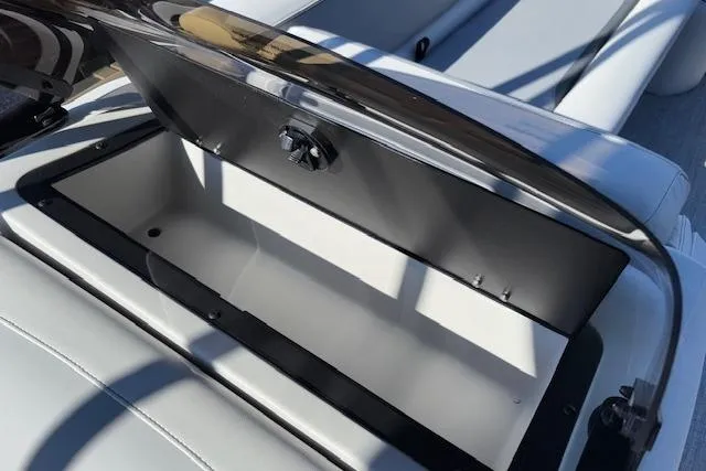 Slide: The Image of Open storage compartment on 2026 Tahoe Pontoon SP 2385 EL boat. - 21