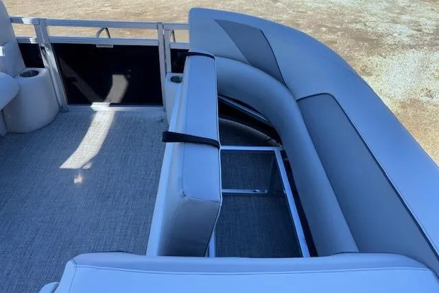 Slide: The Image of 2026 Tahoe Pontoon SP 2385 EL interior with gray seating and carpeted floor. - 22
