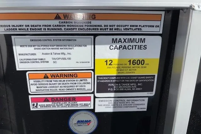 Slide: The Image of Warning and capacity labels on 2026 Tahoe Pontoon SP 2385 EL boat. - 26