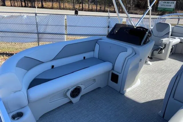 Slide: The Image of 2026 Tahoe Pontoon SP 2385 EL interior with seating and helm, showcasing modern design. - 8