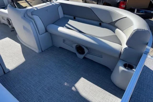 Slide: The Image of 2026 Tahoe Pontoon SP 2385 EL interior with gray seating and cup holders. - 9