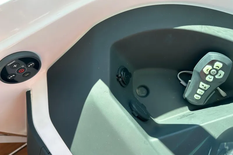 Slide: The Image of Control panel and remote in 2022 Axopar 28 CABIN boat cockpit. - 23