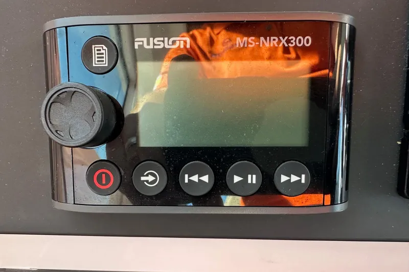 Slide: The Image of Fusion MS-NRX300 audio control panel on 2022 Axopar 28 CABIN boat. - 30