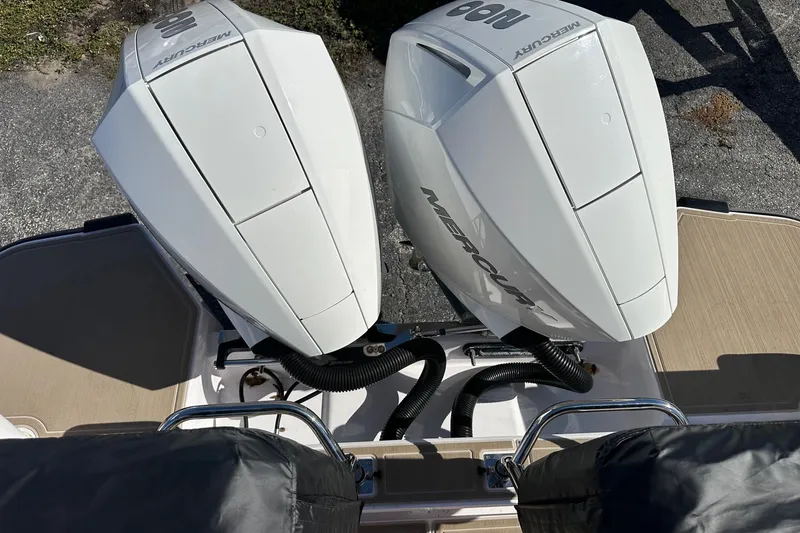 Slide: The Image of Twin Mercury outboard engines on a 2022 Axopar 28 CABIN boat, viewed from above. - 35
