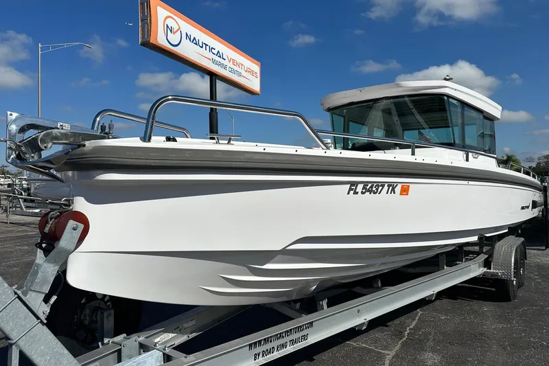 Slide: The Image of 2022 Axopar 28 CABIN boat on trailer at Nautical Ventures Marine Center. - 4