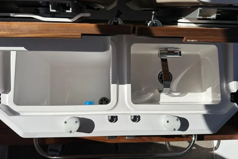 Slide: The Image of 2022 Axopar 28 CABIN boat sink with dual basins and chrome faucet. - 45