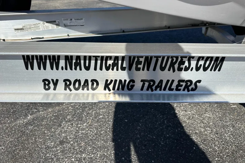 Slide: The Image of Trailer with "www.nauticalventures.com" branding by Road King Trailers, for Axopar 28 CABIN 2022. - 53