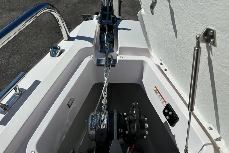 Slide: The Image of 2022 Axopar 28 CABIN anchor compartment with chain and winch system. - 6