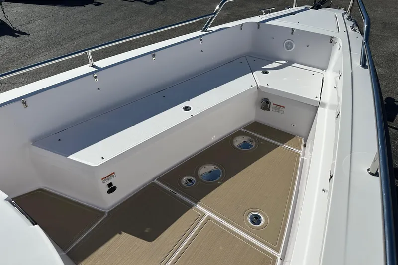 Slide: The Image of 2022 Axopar 28 CABIN boat interior with spacious seating and sleek design. - 7
