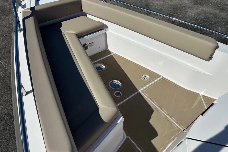 Slide: The Image of 2022 Axopar 28 CABIN boat interior with beige seating and non-slip flooring. - 9