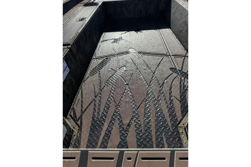 Slide: The Image of 2026 SeaArk 1960 Slayer Pro boat interior with embossed aquatic design. - 16