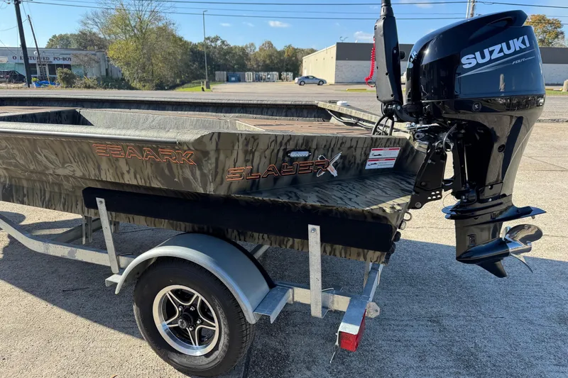 Slide: The Image of 2026 SeaArk 1960 Slayer Pro boat with Suzuki outboard motor on trailer. - 5