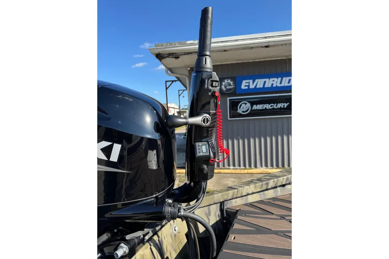 Slide: The Image of 2026 SeaArk 1960 Slayer Pro boat with Suzuki outboard motor, Evinrude and Mercury signage. - 7