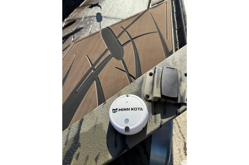 Slide: The Image of 2026 SeaArk 1960 Slayer Pro boat with Minn Kota device on deck. - 9