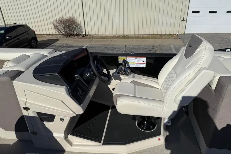 Slide: The Image of 2026 Alera MQ23 boat interior with modern steering console and comfortable seating. - 10