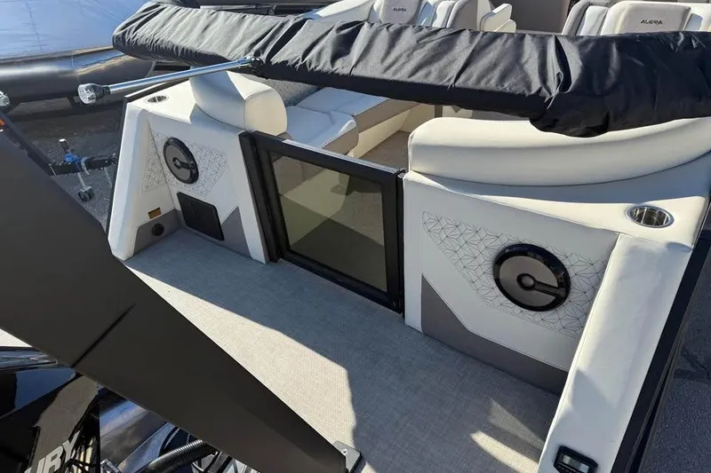 Slide: The Image of 2026 Alera MQ23 boat interior with modern seating and speaker system. - 8