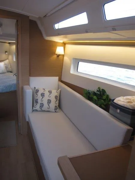 Slide: The Image of Interior of 2024 Jeanneau 380 sailboat with modern seating and decor. - 18