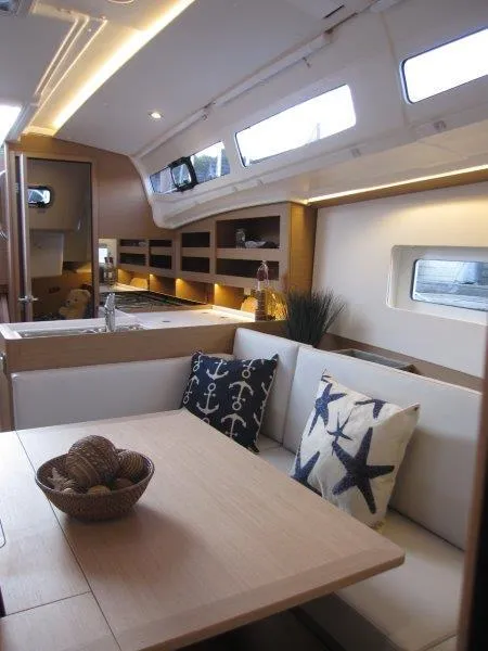 Slide: The Image of Modern interior of 2024 Jeanneau 380 sailboat with cozy seating and nautical decor. - 27