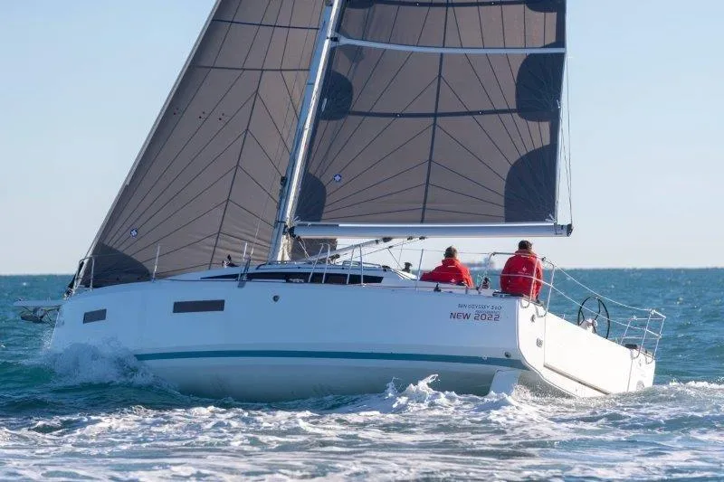 Slide: The Image of Sailing yacht Jeanneau Sun Odyssey 380, 2025 model, cruising on open sea with two sailors. - 50