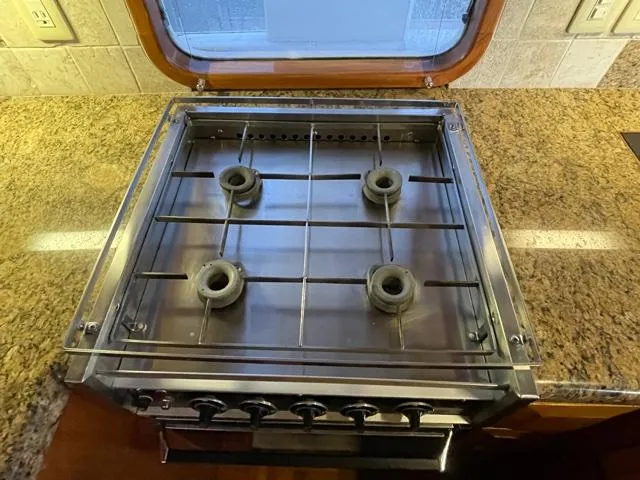 Slide: The Image of Stainless steel stove with four burners on a 1994 DeFever Double Cabin yacht. - 18