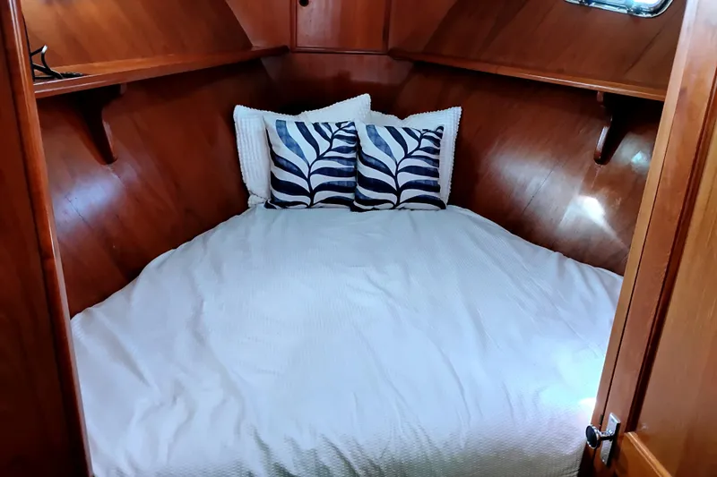 Slide: The Image of Cozy cabin interior of 1994 DeFever Double Cabin with wood paneling and decorative pillows. - 22