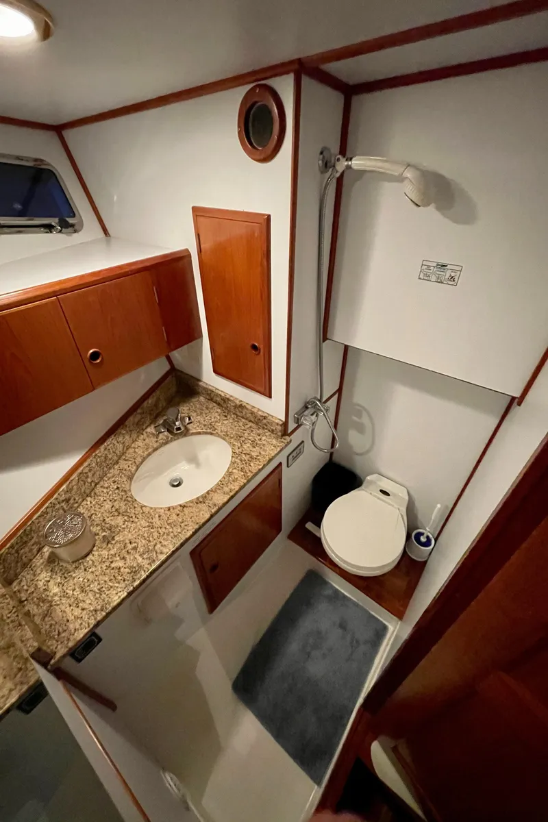 Slide: The Image of 1994 DeFever Double Cabin bathroom with granite countertop, sink, and shower. - 31