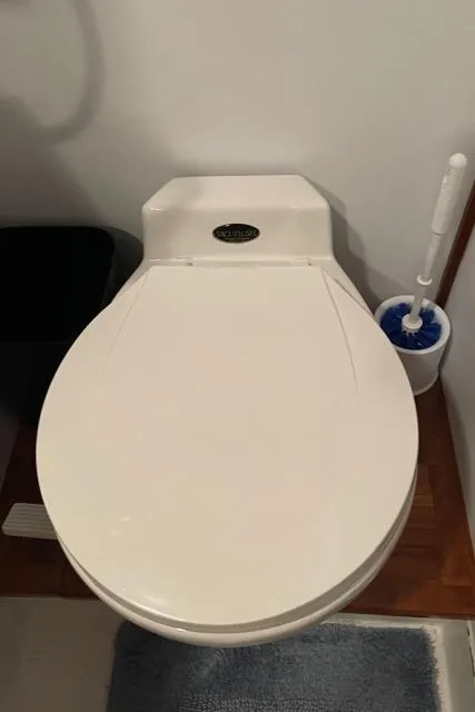 Slide: The Image of 1994 DeFever Double Cabin bathroom with white toilet and brush set. - 32