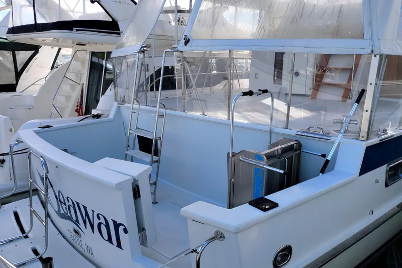 Slide: The Image of 1994 DeFever Double Cabin yacht with enclosed deck, docked in Seattle marina. - 4