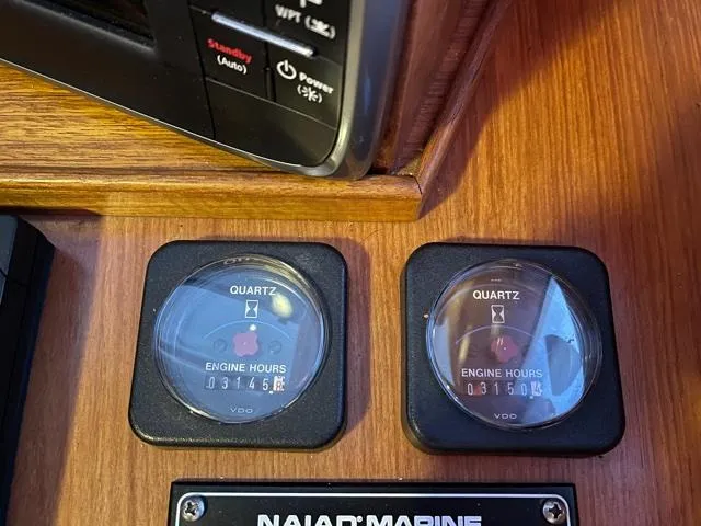 Slide: The Image of Engine hour meters on 1994 DeFever Double Cabin boat dashboard. - 48