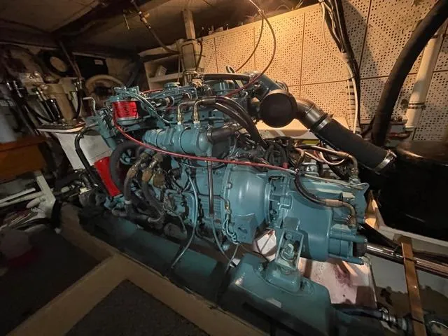 Slide: The Image of Engine room of a 1994 DeFever Double Cabin boat, showcasing detailed machinery. - 57