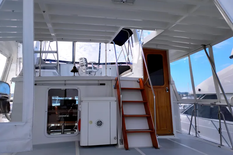 Slide: The Image of 1994 DeFever Double Cabin yacht interior with stairs and wooden door. - 6