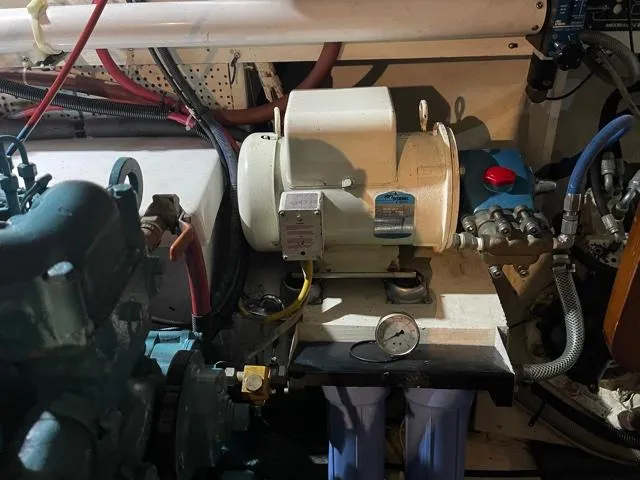 Slide: The Image of Engine room of 1994 DeFever Double Cabin with mechanical components and wiring. - 60