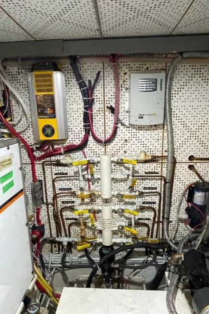 Slide: The Image of Engine room wiring and plumbing of a 1994 DeFever Double Cabin yacht. - 61