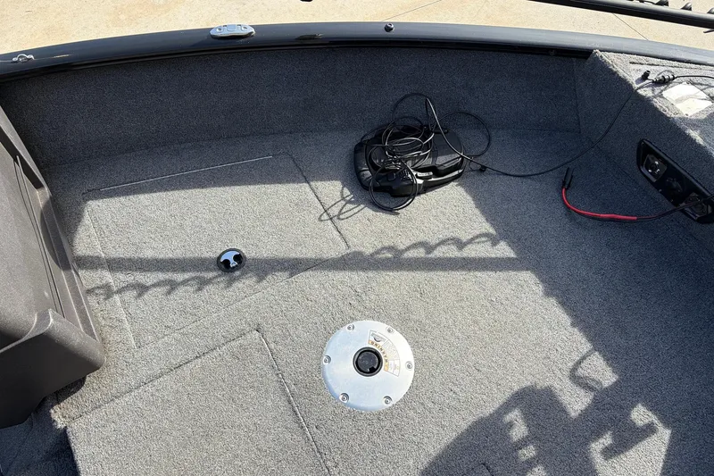 Slide: The Image of 2022 Tracker Pro Guide V-175 Combo boat interior with carpeted deck and wiring. - 16