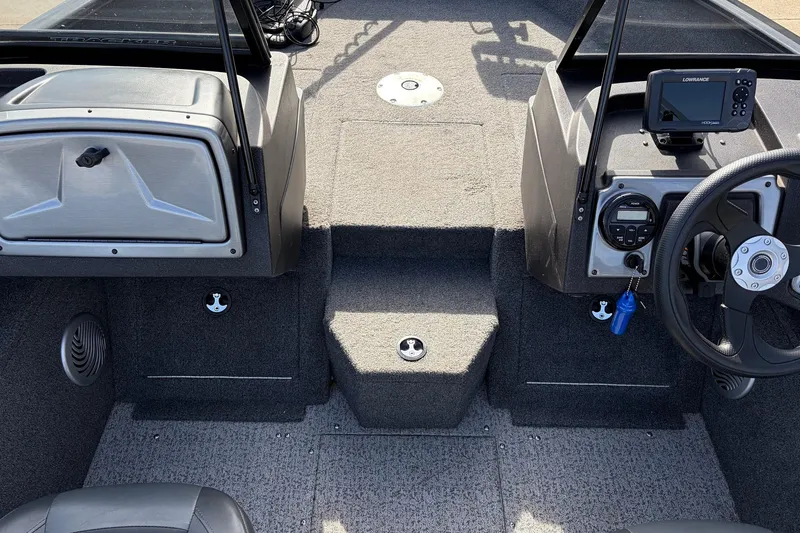 Slide: The Image of 2022 Tracker Pro Guide V-175 Combo boat interior with steering wheel and control panel. - 18