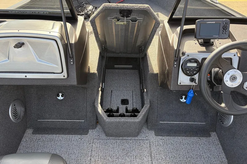 Slide: The Image of 2022 Tracker Pro Guide V-175 Combo boat interior with steering wheel and control panel. - 19