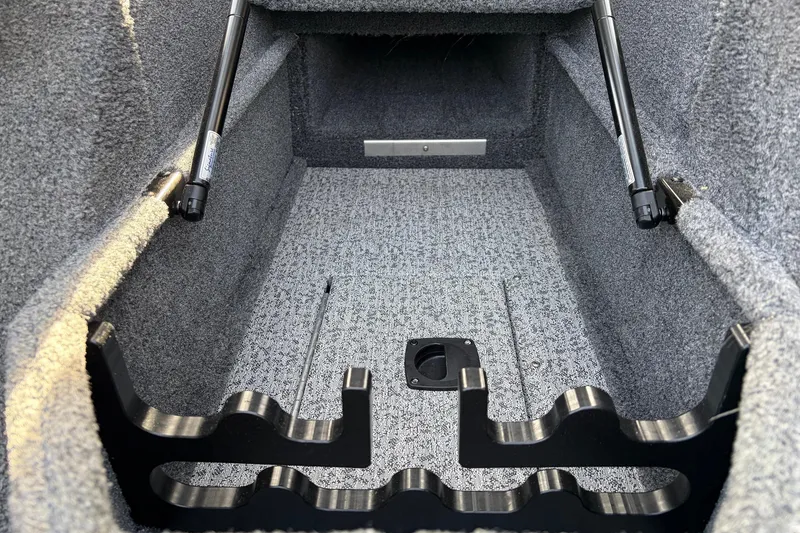 Slide: The Image of 2022 Tracker Pro Guide V-175 Combo interior storage compartment with rod holders. - 20