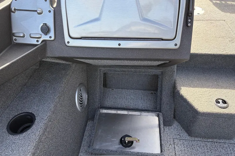 Slide: The Image of 2022 Tracker Pro Guide V-175 Combo boat interior with storage compartments and control panel. - 23