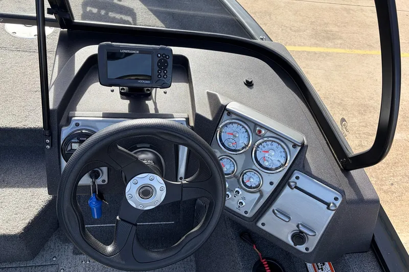 Slide: The Image of 2022 Tracker Pro Guide V-175 Combo dashboard with steering wheel and gauges. - 27